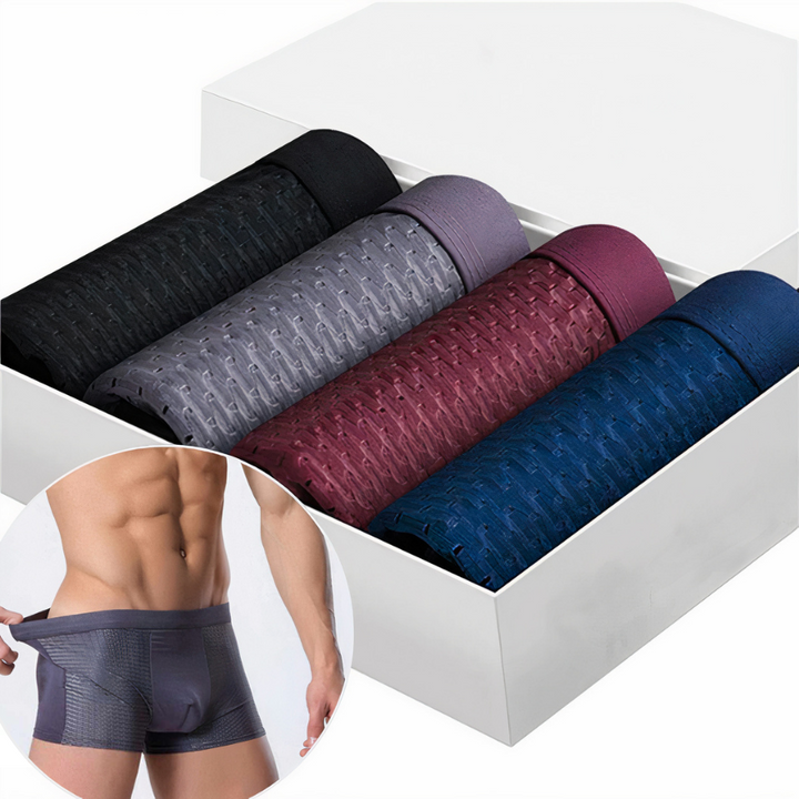 Fire rullede boxershorts i sort, grå, bordeaux og marineblå i hvid æske, med model i cirkel 1