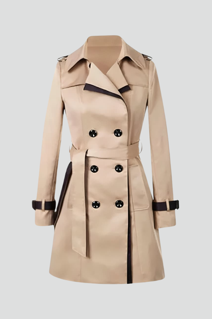 Beige dobbeltradet trenchcoat med sorte kanter, sorte knapper og bindebælte, vist alene mod lys baggrund uden model. 1