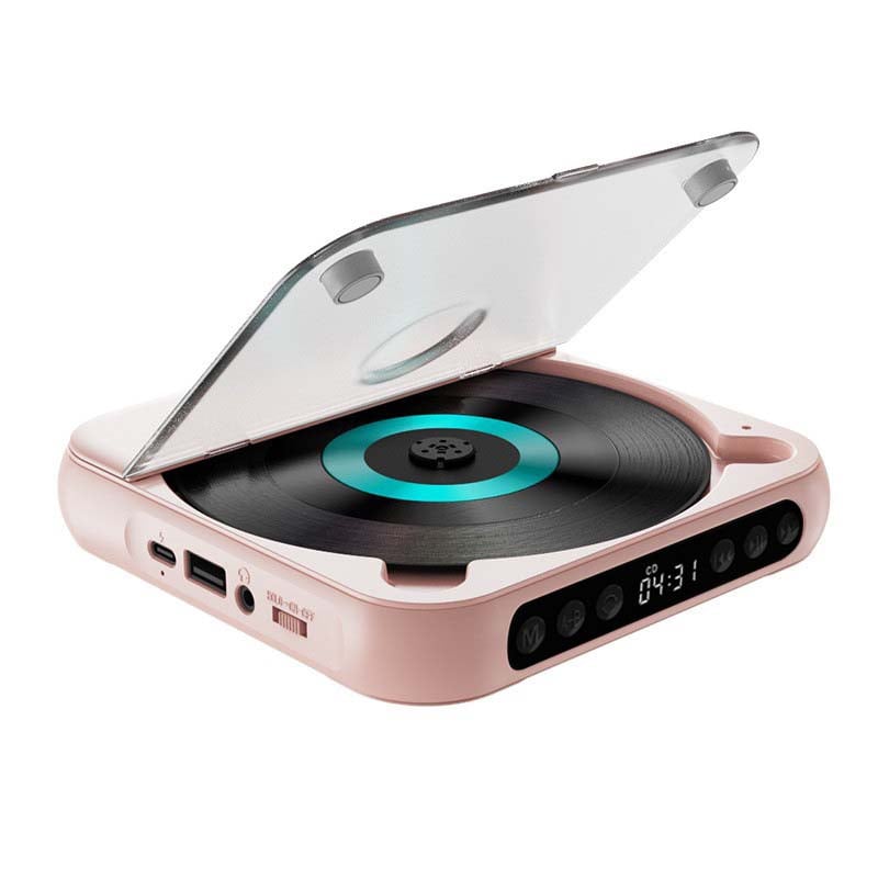 Lyserød afspiller med åbent låg og turkis ring skråt oppefra, med USB-port, hovedtelefonudgang og tænd/sluk-kontakt i siden. 14