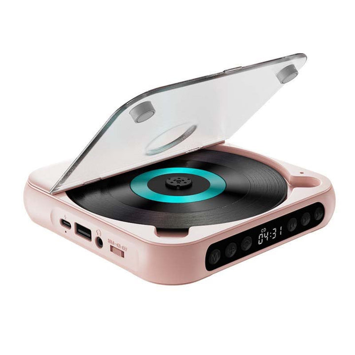 Lyserød afspiller med åbent låg og turkis ring skråt oppefra, med USB-port, hovedtelefonudgang og tænd/sluk-kontakt i siden. 14