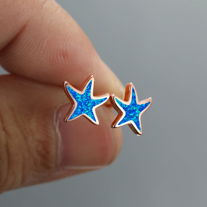 Blaue Stern-Ohrringe aus Opal, roségoldene Fassung, handgefertigter Schmuck, modisch.