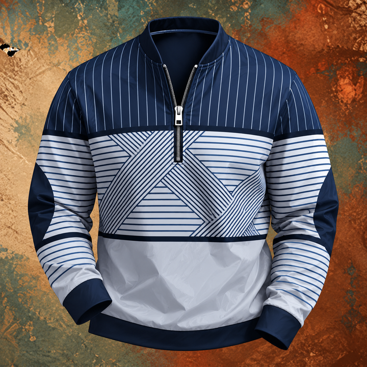 Marineblå og hvid stribet pullover med halv lynlås og geometrisk mønster, set forfra mod farvet baggrund. 2