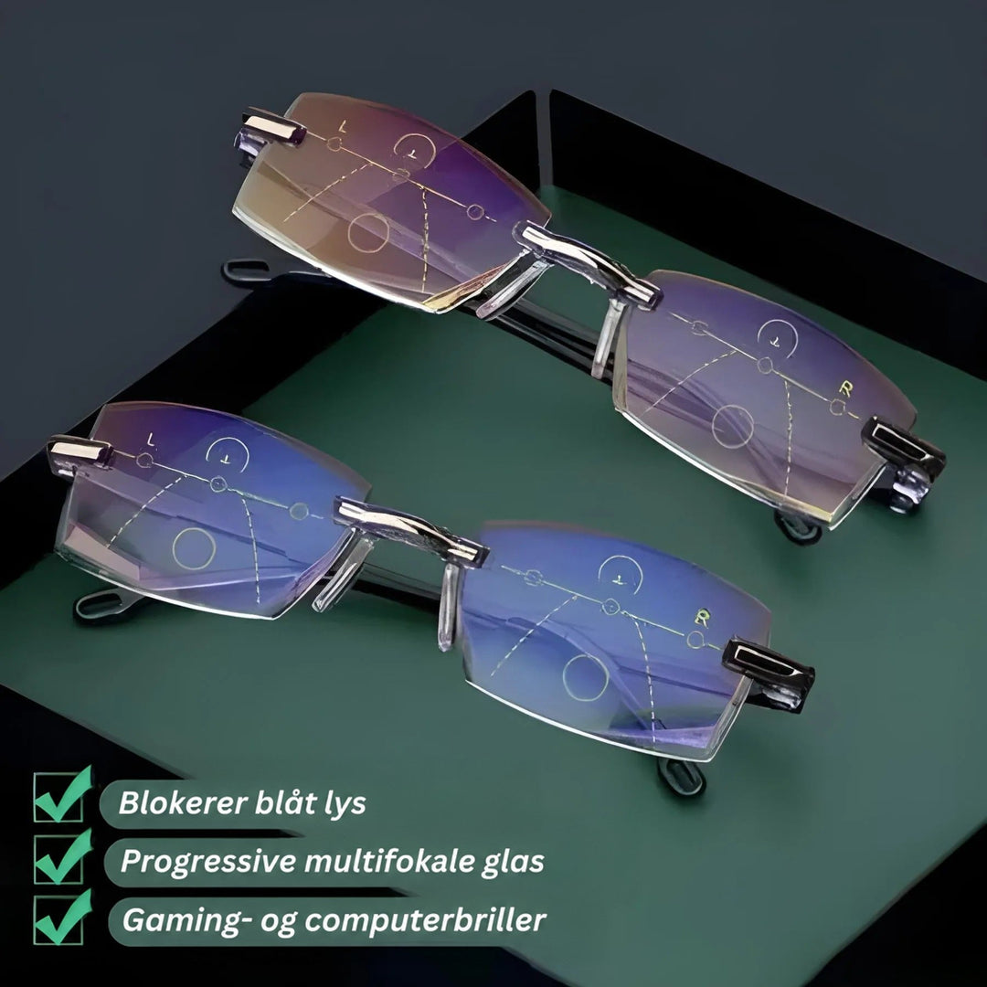 To par kantløse briller på en grøn og sort plade, hvor de progressive glas viser tydelige synszoner med cirkler og stiplede linjer. 3