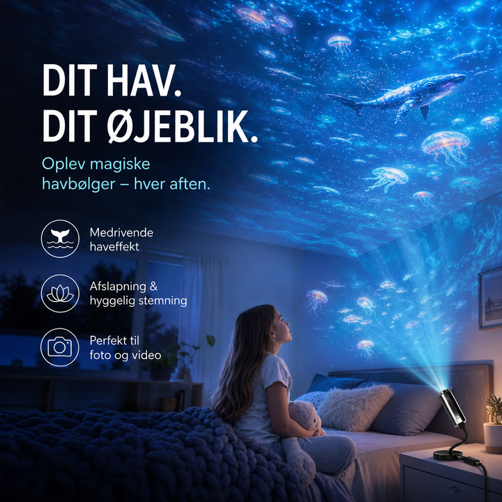 Projektoren på natbordet kaster havmotiver med hval og vandmaneter på loftet, mens en pige i sengen ser op 3