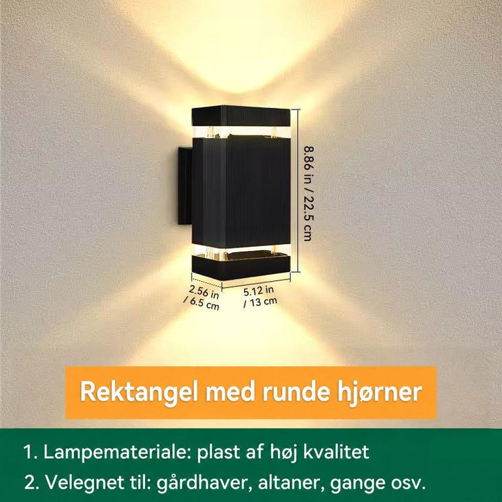 Kompakt rektangulær væglampe med ét lysbånd i hver ende, vist med mål for højde, bredde og dybde 16