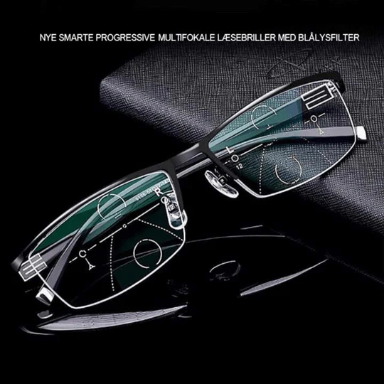 Halvbrille med sort metalstel hvilende på en mørk skinnende overflade, set skråt fra siden 1
